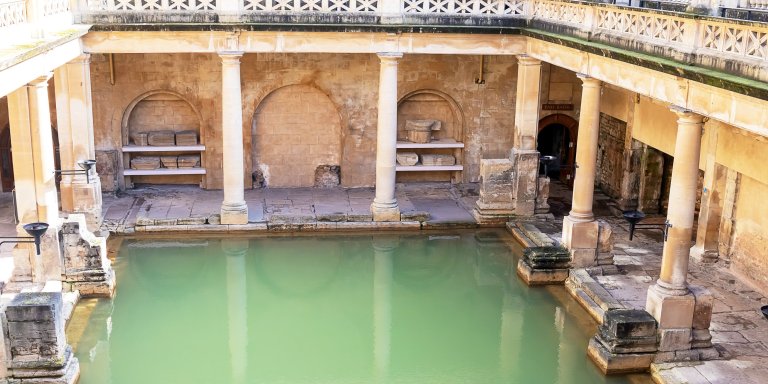 Historic Roman baths in the city of Bath, England, showcasing ancient architecture and cultural significance.