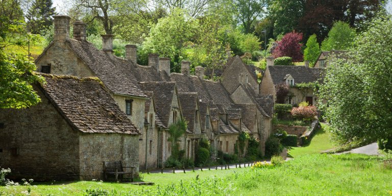 Bibury: A picturesque village in England with charming stone cottages.