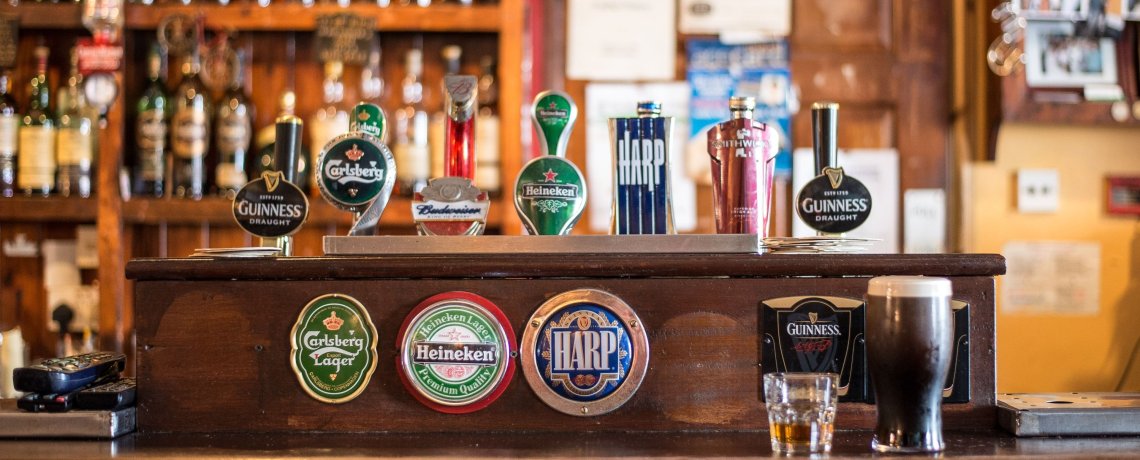 A bar counter in an Irish pub